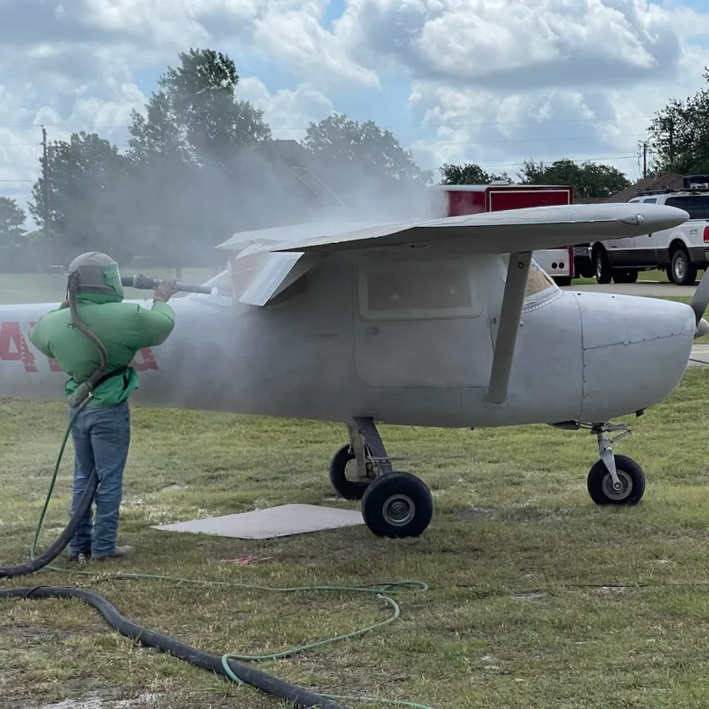 Soda blasting an aircraft.